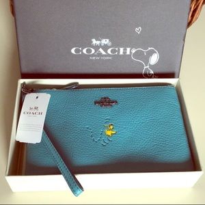 Leather Coach Wristlet featuring Peanuts Woodstock